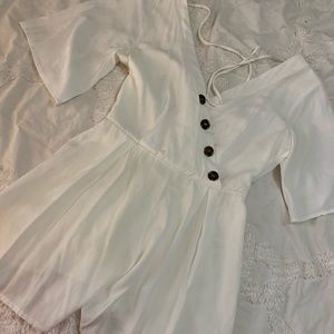White romper with buttons